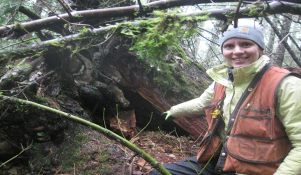 Vanessa points to the den where we located the female black bear and her cub. 
