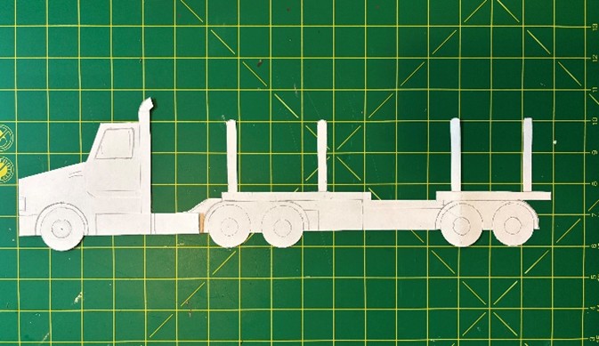 Paper cutout of a log truck.